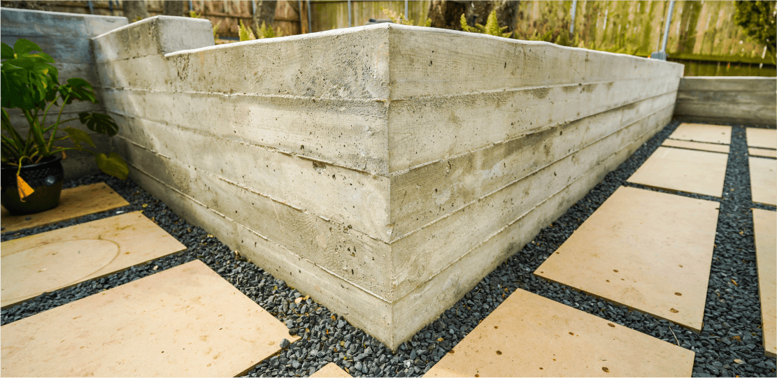 Corner of a concrete retaining wall.
