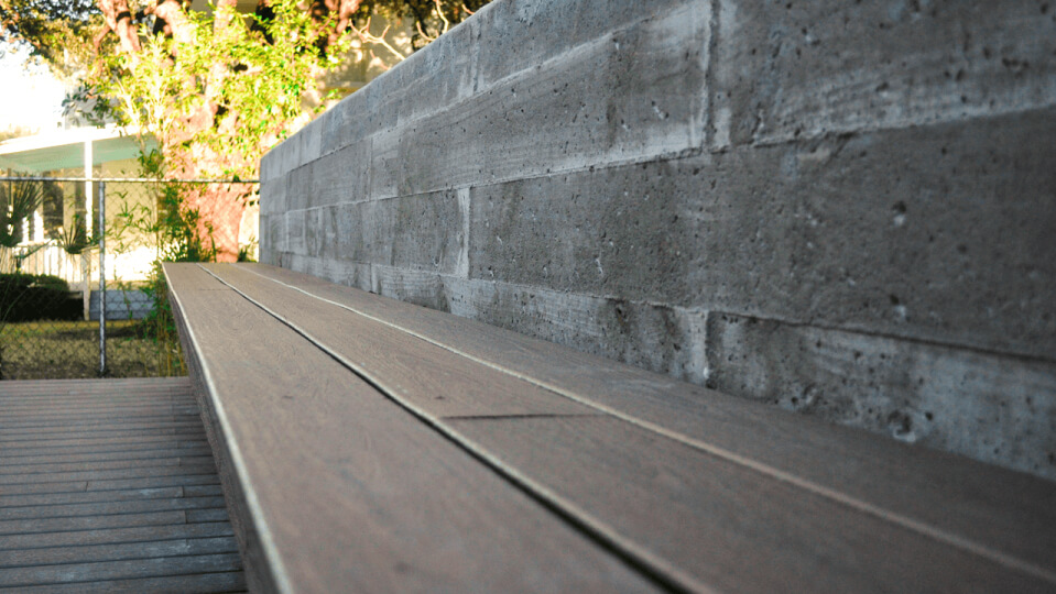 Close up side view of a wooden bench.