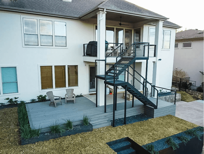 View of the back of a house with large black stairs