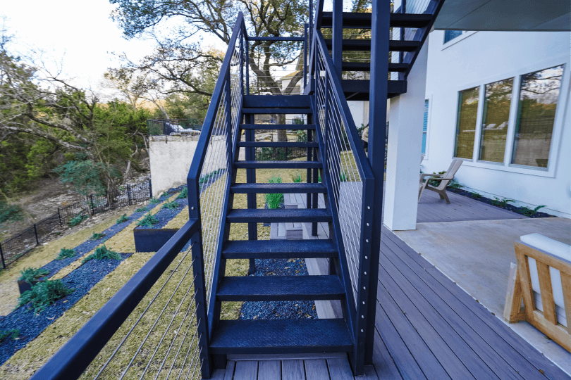 Close up of black stairs in a backyard