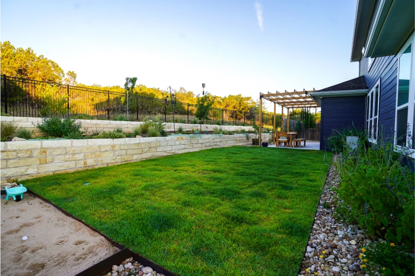 Cutters-trails of dripping springs grassy landscaped yard