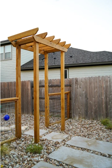 Cutters-trails of dripping springs wooden pergola bed of rocks