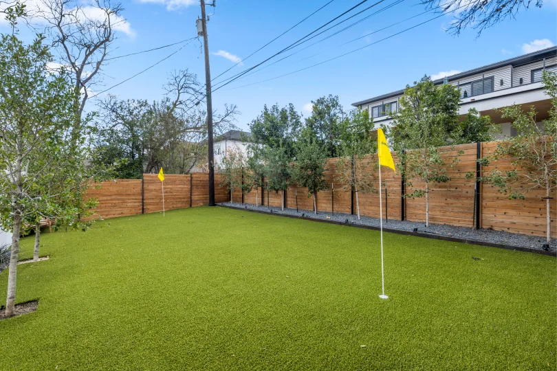 Putting green in the backyard of a home in Rosedale.